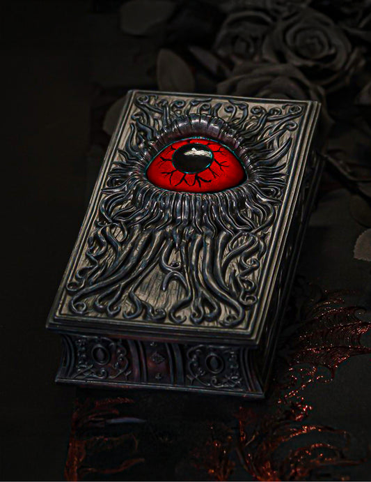 Livro decorativo em resina com olho vermelho sangue 20 cm