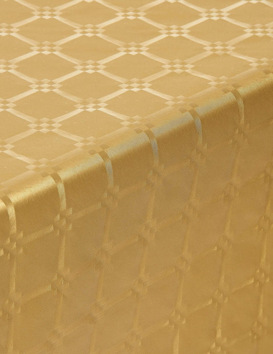 Gros plan sur le motif de la nappe en rouleau papier damassé pour fête doré jetable