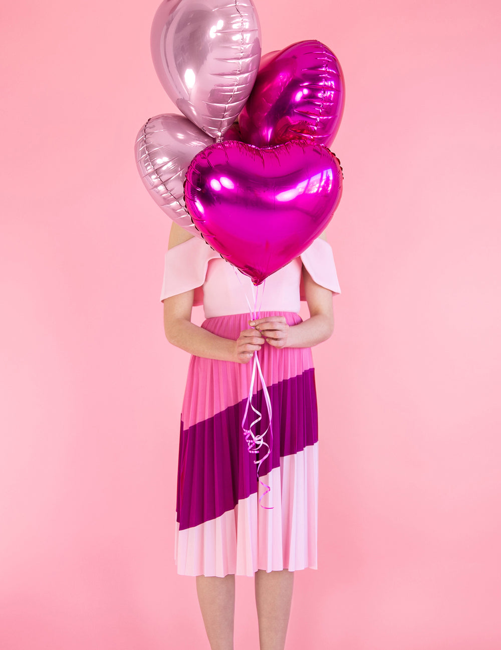 Mise en situation en bouquet du ballon coeur rose brillant