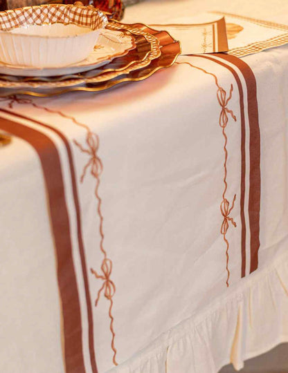 Caminho de mesa Lindos nós em tecido creme auburn e terra queimada 28 cm x 3 m