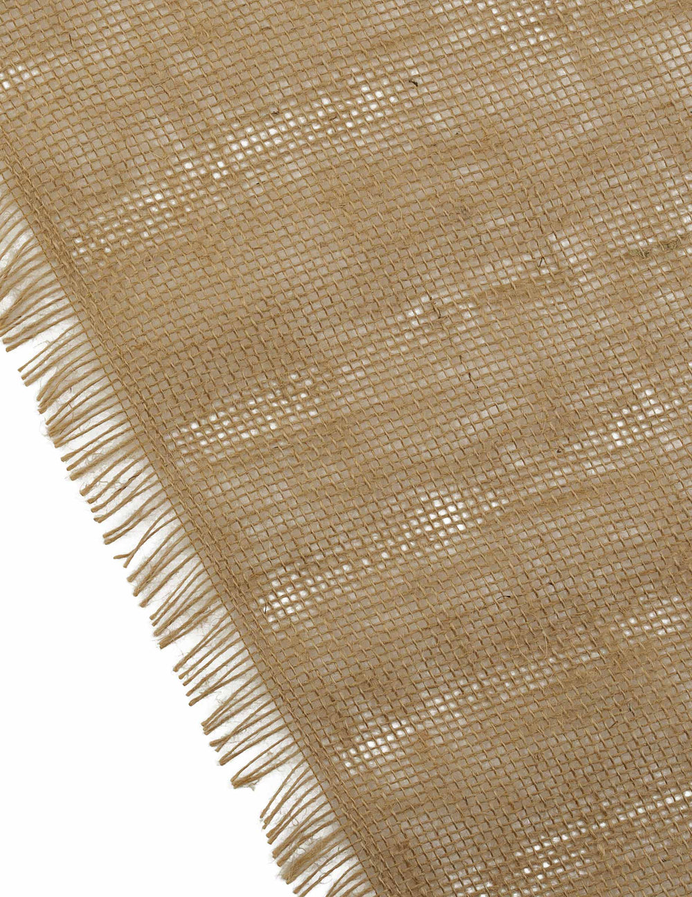 Détail des franges et du tissage du chemin de table bohème chic