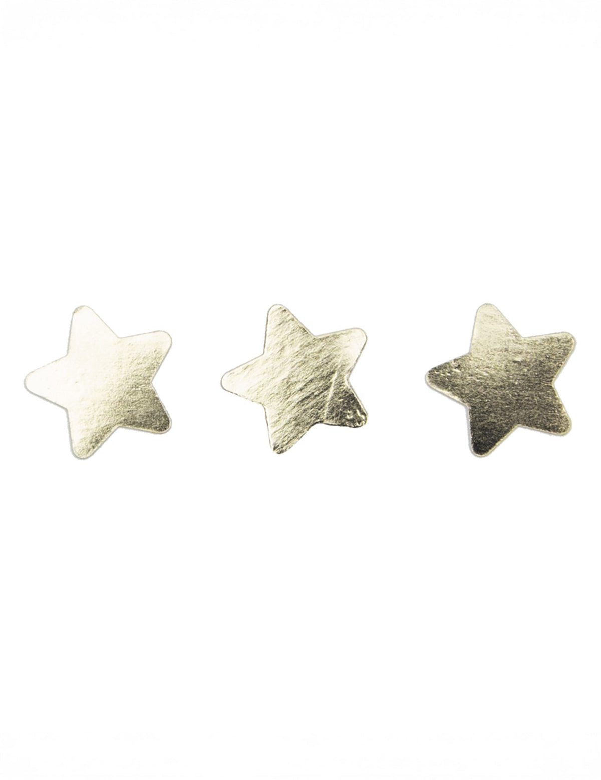 Gros plan sur trois pièces du Confettis de table étoiles pour décoration de fête