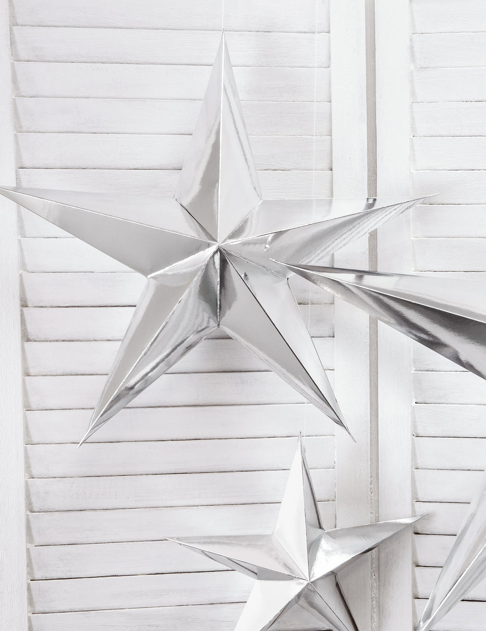 Mise en scène de la décoration à suspendre étoile pour Noël