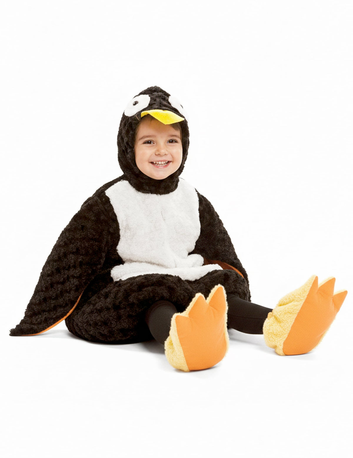 Vue de face enfant assis du déguisement de pingouin peluche