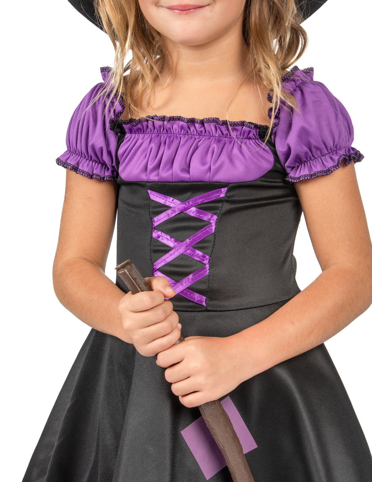 Détail du bustier et du manche du balai du déguisement de sorcière pour fille