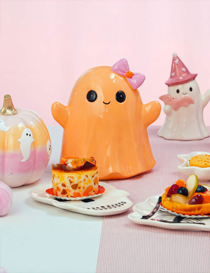 Fantasma sorridente em resina laranja pastel 20 cm