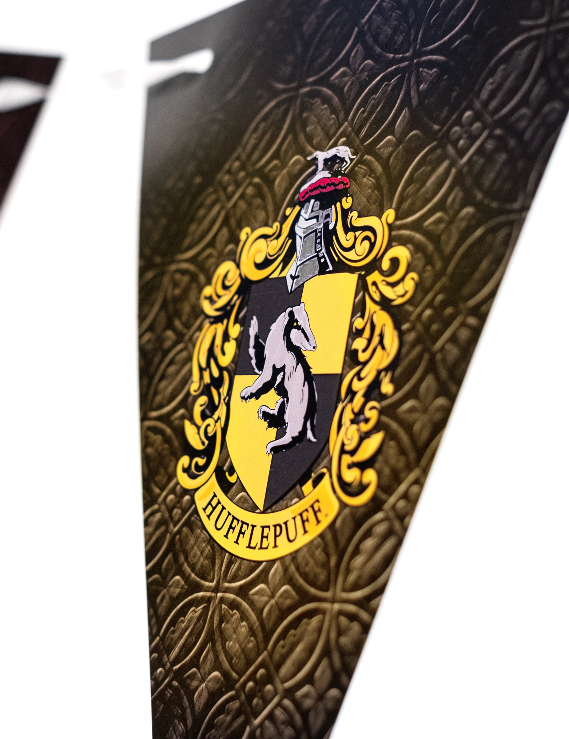 Détail du blason de Poufsouffle de la guirlande à fanions Harry Potter