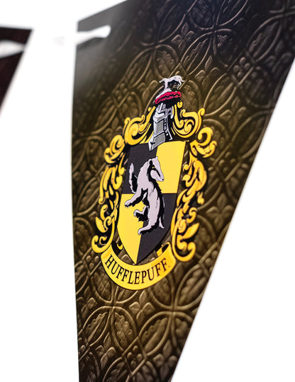 Détail du blason de Poufsouffle de la guirlande à fanions Harry Potter