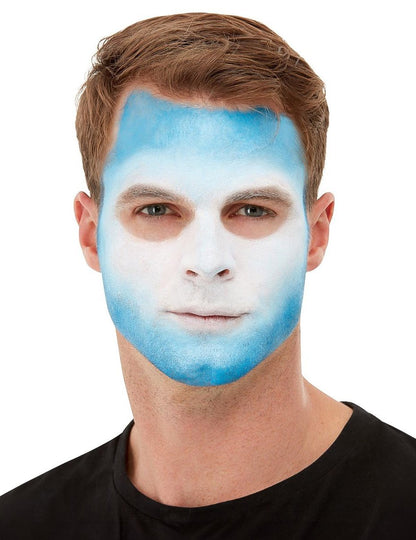 Maquillage bleu et blanc appliqué sur le visage du kit maquillage et tatoo Dia de los Muertos