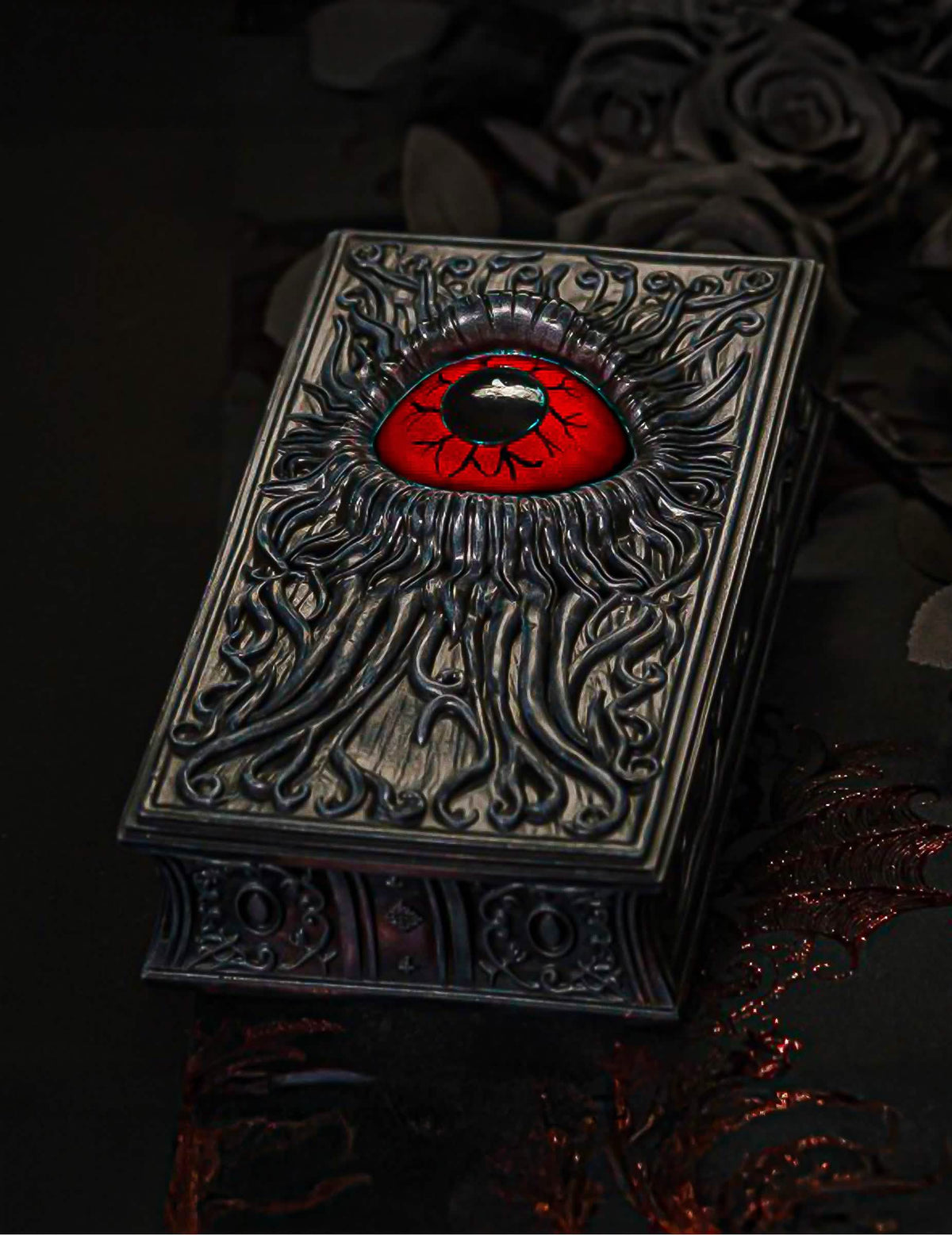 Livro decorativo em resina com olho vermelho sangue 20 cm