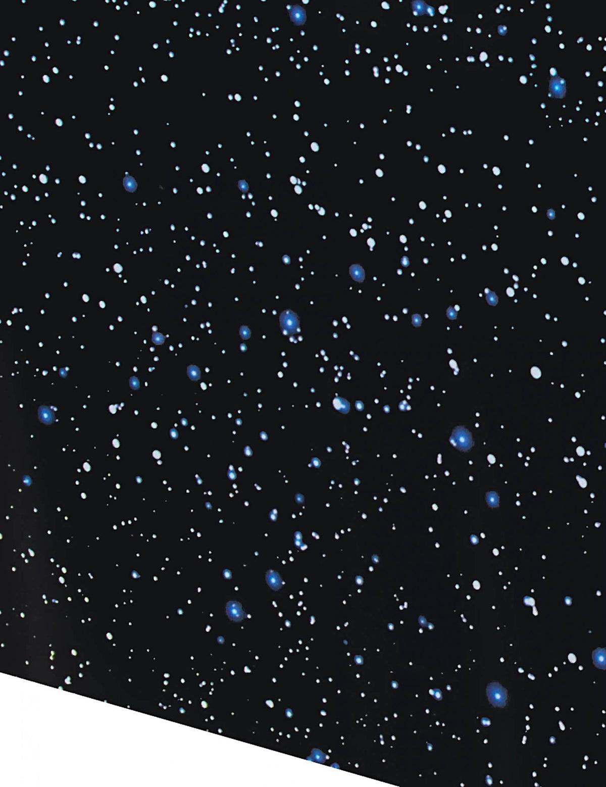 Gros plan sur le motif ciel étoilé de la nappe en plastique espace pour anniversaire