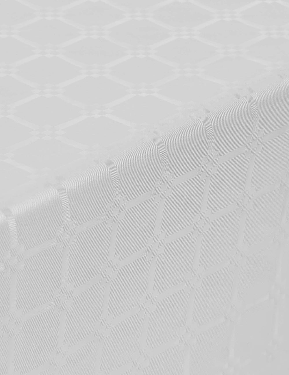 Detalhe do motivo adamascado da toalha de mesa em rolo de papel adamascado branca