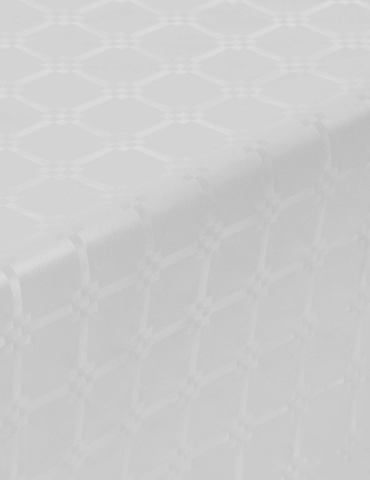 Detalhe do motivo adamascado da toalha de mesa em rolo de papel adamascado branca