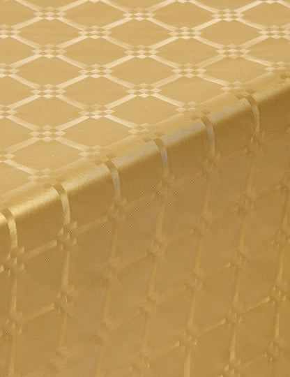 Gros plan sur le motif de la nappe en rouleau papier damassé pour fête doré jetable