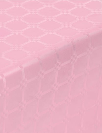 Détail des motifs de la nappe en rouleau papier damassé rose pastel