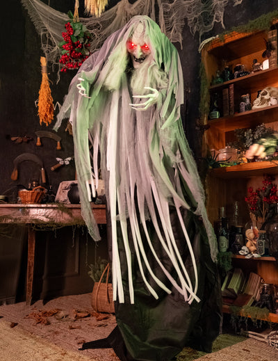 Sorcière animée pour décoration d'Halloween verte et grise aux yeux rouges